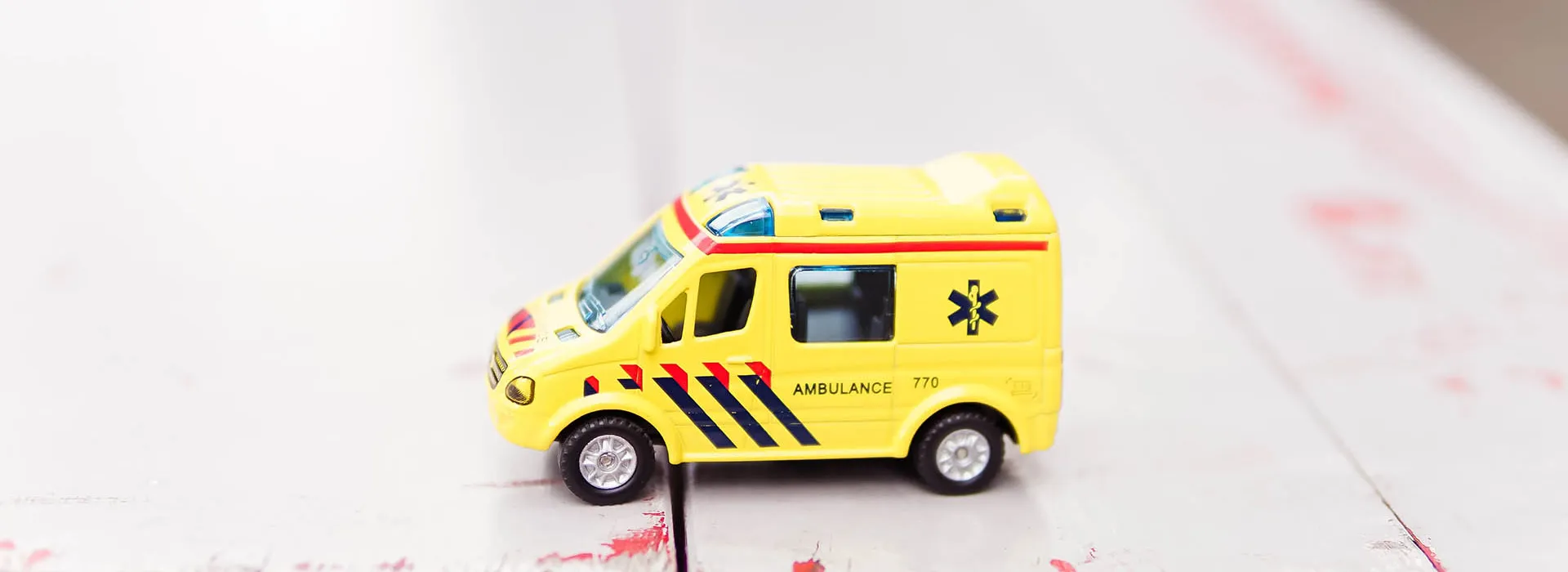 toy ambulance wooden surface 